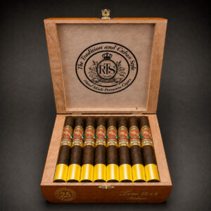 Open cedar box of 25 RTS Cigars Toro 52 x 6 Super Premium, hand-rolled cigars with gold RTS bands under a "Tradition and Cuban Style, Hand Made Premium Cigars" lid emblem