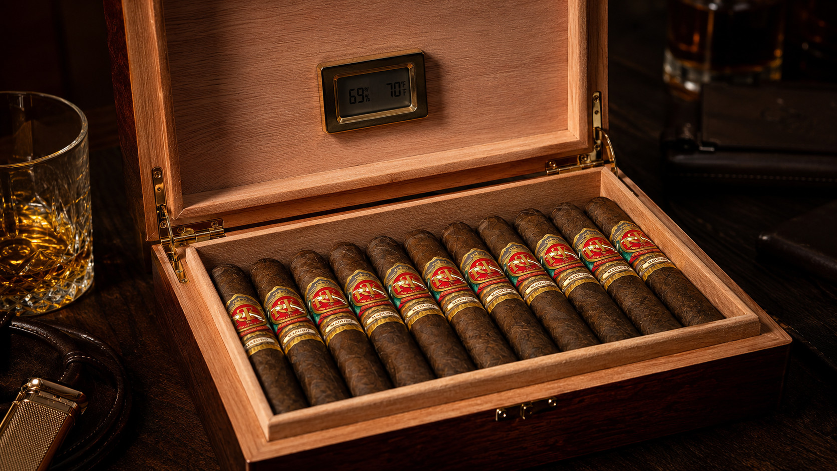 How to store cigars: an open Spanish cedar humidor holding rows of premium cigars